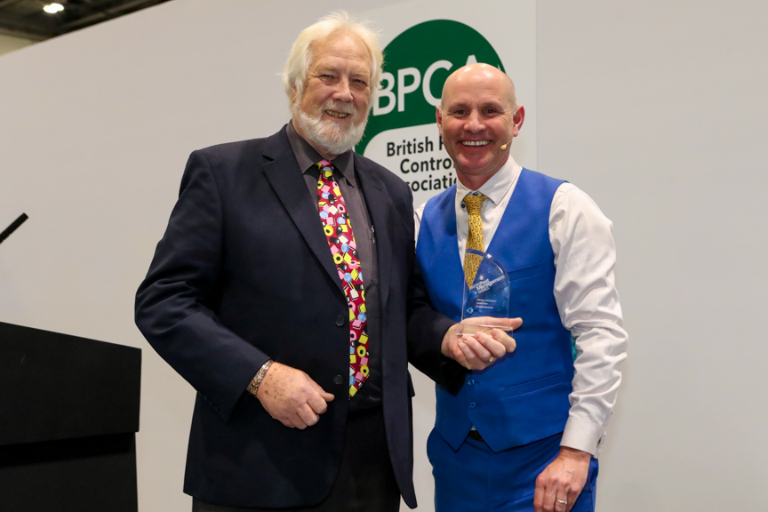 Dr Jonathan Wade (left) being presented his Lifetime achievement award by television ecologist Mike Dilger (right)